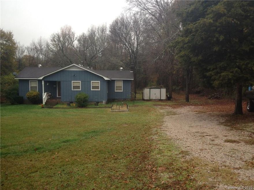 Traditional 3 bedroom family home on private 1 acre lot.  Perfect for investors or family who could put a little tlc into this lovely home.  House is in great shape, just needs updating.  Fireplace in living room.  Newer laminate in living room and master bedroom.  Listed under tax value!