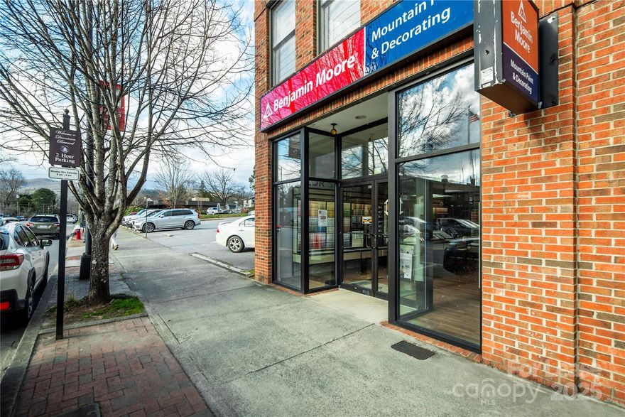 This storefront unit is perfectly situated in downtown Brevard for retail and/or office space, directly across from Brevard City Hall. Parking includes street-side parking directly in front of the building and across the street, as well as a free public parking lot directly adjacent to the unit. The space is solidly located at an anchor position of Brevard’s bustling downtown business scene, a block and a half from the Main and Broad Street intersection. Restaurants, shops, a hardware store, a movie theater, city and county offices, and a variety of retail spaces and offices share the area, all within easy walking distance. A modern, all-glass storefront welcomes visitors, while re-designed and newly-landscaped sidewalks and curbside amenities encourage tourists and locals alike to enjoy the downtown area.