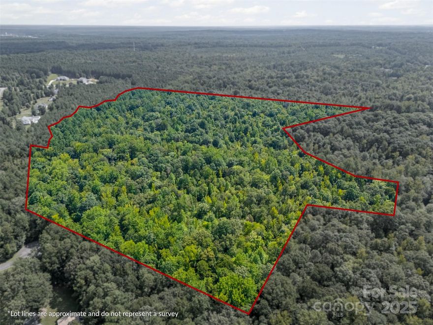 Tucked away in a private setting, this 57± acre tract offers a rare opportunity in Rock Hill. Beautifully wooded with a gentle slope rolling to a creek along one property line, the land provides natural beauty and privacy while still being just a short drive to Rock Hill’s conveniences.  You'll also appreciate easy access to I-77 for commuting to Charlotte or Columbia. Approved soil testing is already in place standard septic systems in multiple sites (10 identified), making the path to building even smoother. This large tract opens the door to multiple possibilities—from building your own private estate to pursuing approval for a major subdivision. Whether you’re looking for recreational use, investment potential, or development opportunity, this tract offers it all.
