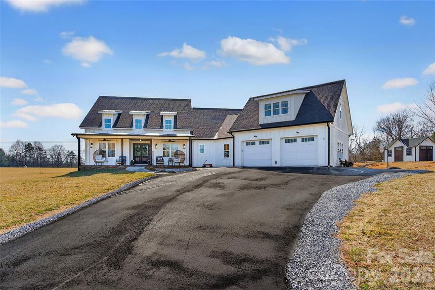 Welcome to this stunning custom-built modern farmhouse, located in the gated community of Bent Creek. The home was completed in 2022 and thoughtfully crafted with high-end finishes and functional living spaces throughout. This exceptional home seamlessly blends timeless charm with modern design, offering both everyday comfort and refined style.

Luxury wide-plank vinyl flooring runs throughout the home, complementing the open-concept layout that flows effortlessly from the welcoming foyer into the spacious living room and chef’s kitchen. Exposed knotty alder wood beams and a striking shiplap fireplace create warmth and architectural character, making the main living area both elegant and inviting.

The chef’s kitchen is truly the heart of the home, featuring custom shaker cabinetry, a large center island, farmhouse sink, and convenient pot-filling station. Abundant storage and a generous walk-in pantry with butcher block countertops ensure both beauty and functionality. Just off the kitchen, the oversized laundry room offers additional custom shaker cabinets, a farmhouse sink, and ample workspace for daily convenience.

Designed with families in mind, the home offers two spacious secondary bedrooms, each with its own dressing area, connected by a Jack-and-Jill bathroom with dual sinks. The open floor plan enhances natural light and creates an ideal setting for both entertaining and everyday living.

The primary suite is a private retreat, highlighted by tray ceilings and shiplap accent walls. The spa-inspired primary bathroom features custom vanity spaces, separate his-and-her closets, and an oversized tiled shower complete with a custom rain shower head.

Outdoor living is equally impressive, with concrete porches adorned with ceiling fans and custom wood porch ceilings that extend the farmhouse aesthetic outdoors. A large patio provides the perfect setting for entertaining guests or enjoying quiet evenings at home.

Upstairs, a massive bonus room offers endless flexibility for a media room, playroom, home office, or guest space, along with additional attic storage. The encapsulated crawlspace enhances energy efficiency and helps reduce heating and cooling costs.

With its spacious layout, custom craftsmanship, and carefully curated finishes, this modern farmhouse stands out as a rare find. Thoughtfully designed and beautifully executed, this is truly a must-see property.