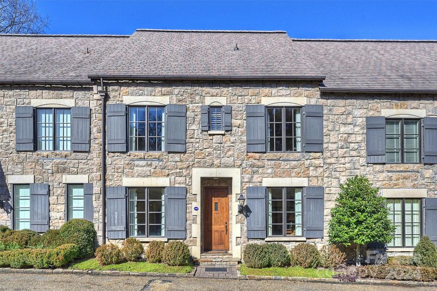 This Eastover townhome is located on one of two private streets in Chipping Campden, a village of fifteen cottages modeled after classic English architecture inspired by villages in the Cotswolds. Situated on three acres, the townhouse overlooks an ornate English garden, a fountain and a stone fireplace. Inside, you will feel instantly at home with 9 foot ceilings with hand troweled plaster walls creating a rustic feeling. A large living room with fireplace, gorgeous dining room and kitchen overlook a wrought iron fenced patio with a built in gas grill. The common grounds in the back contribute to the privacy of the home. There is a bedroom on the first floor, a primary on the second level with a juliette balcony overlooking the green space, and two additional bedrooms, baths and laundry room. The 3rd floor has been finished and currently used for a work out space. The townhouse features a two car garage, ample community parking spaces and an LEV elevator with telephone. A RARE FIND!