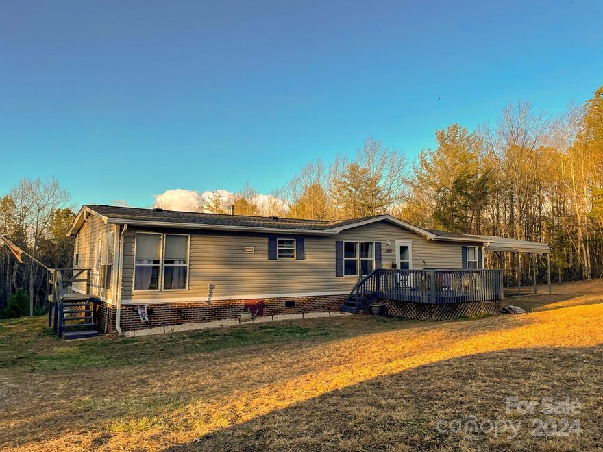 Spacious and so many extras! Step inside to an open floor plan, split-bedroom and spacious kitchen with both dining and breakfast areas. 3 bedroom, 2 bathroom, 1458 sq ft on 2 deeded acres in eastern Burke County. Extras...Double car shed, 12x20 wired outbuilding, fenced back yard, water-right filtration system, new rear porch, brand new roof! See it asap!!