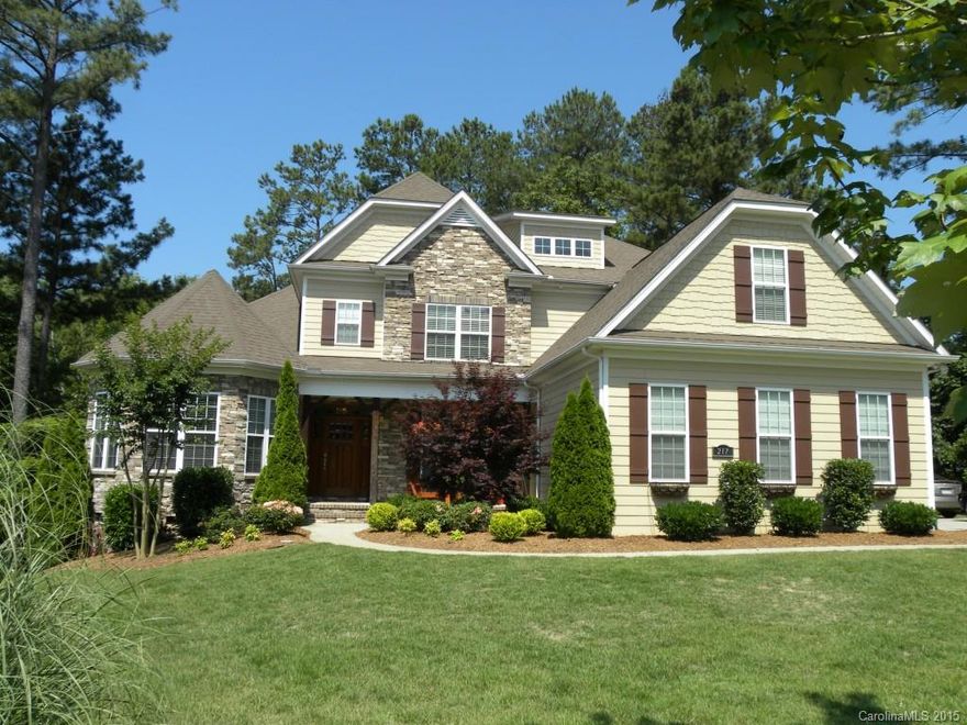 Beautiful move in ready custom home with lake view. A cook's kitchen with custom cabinets, granite countertops and tile backsplash. The inviting kitchen opens up to the family room with a stacked stone fireplace. Large master bedroom with master bath and oversized shower and garden tub on the main level. There is an additional space for a home office and a bonus/media room.  Additional storage under the house. You can walk to the neighborhood lake access with a canoe launch.