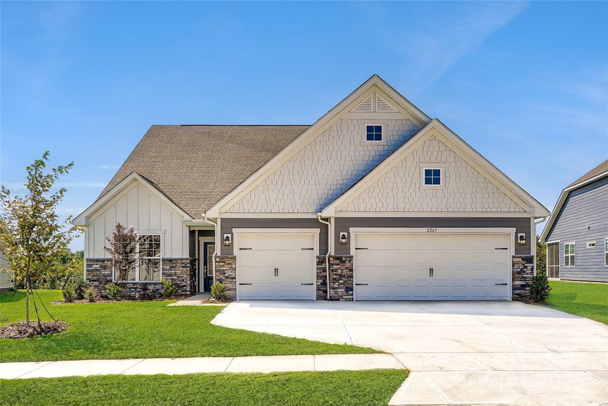 The Garland floorplan is a new single-story home design that combines comfort and elegance. It features a formal living and dining room for entertaining, a family room with a fireplace for casual gatherings, a covered porch, three-car garage and a sunroom for indoor-outdoor living. Two secondary bedrooms and a lavish owner’s suite are made for rest and relaxation. Plus, our signature Everything's Included program means you will get a gourmet kitchen with double ovens and cooktop, quartz or granite kitchen countertops, subway tile backsplash, ceramic tile, luxury vinyl plank flooring throughout the home, and a gas fireplace (per plan). Roselyn is a master-planned community offering exclusive ranch homes designed for active adults!