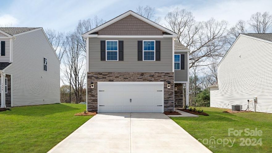 The Aisle is a spacious & modern two-story home designed with open concept living in mind. This home features four bedrooms, two & a half bathrooms & a two-car garage, making it perfect for your new home. Upon entering the home, you'll be greeted by an inviting foyer that leads directly into the heart of the home: the great room. This impressive space features a living room, dining area, and well-appointed kitchen. The kitchen is equipped with a pantry, stainless steel appliances, & a large island with a breakfast bar, making it perfect for both cooking and casual dining. Home also features a primary suite, complete with a large walk-in closet and en suite bathroom featuring dual vanities and a spacious shower. The additional three bedrooms share a full bath that includes dual vanities. Outback is a patio, perfect for outdoor entertaining or enjoying beautiful weather. With its thoughtful design, spacious layout, and modern conveniences, the Aisle is the perfect place to call home.