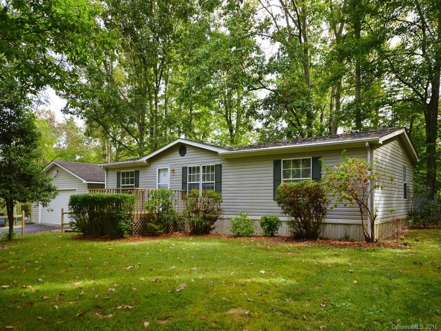 Large lot with convenient location to DT Weaverville, schools, restaurants, and shops creates a prime location for this home.  Large 1.15 acre lot with excellent curb appeal and plenty of room to roam.  Home sits well back from main road.  New carpet throughout, paint, and detached 2 car garage with workspace make this a great buy.  Portion of DB and PG.  Peaceful setting.  Newer heat pump and screened back porch make this a great opportunity.  Portion of DB and PG.  Unable to verify septic.