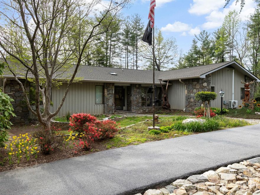 Tucked away on a private, beautifully landscaped lot in desirable Flat Rock, this thoughtfully designed
home blends comfort and style. The inviting great room features a striking stone fireplace and custom
built-ins. The kitchen offers abundant cabinetry, granite countertops, newer appliances, and a bright
breakfast area perfect for everyday living. The floorpan provides immense privacy, with a spacious primary
suite boasting a walk-in closet and a beautiful ensuite bath with soaking tub and tiled shower. Guest
bedrooms are generously sized, with updated baths showcasing quality finishes. The lower level expands
your options with a large family room, full bath, workshop with sink, and ample storage. Outdoor areas
boast expansive and professionally-designed stone walkways and garden areas throughout the large lot.
Also an updated all-season porch and deck overlooking a fenced, private backyard. The oversized garage
also accommodates RV parking and will definitely excite car enthusiasts.