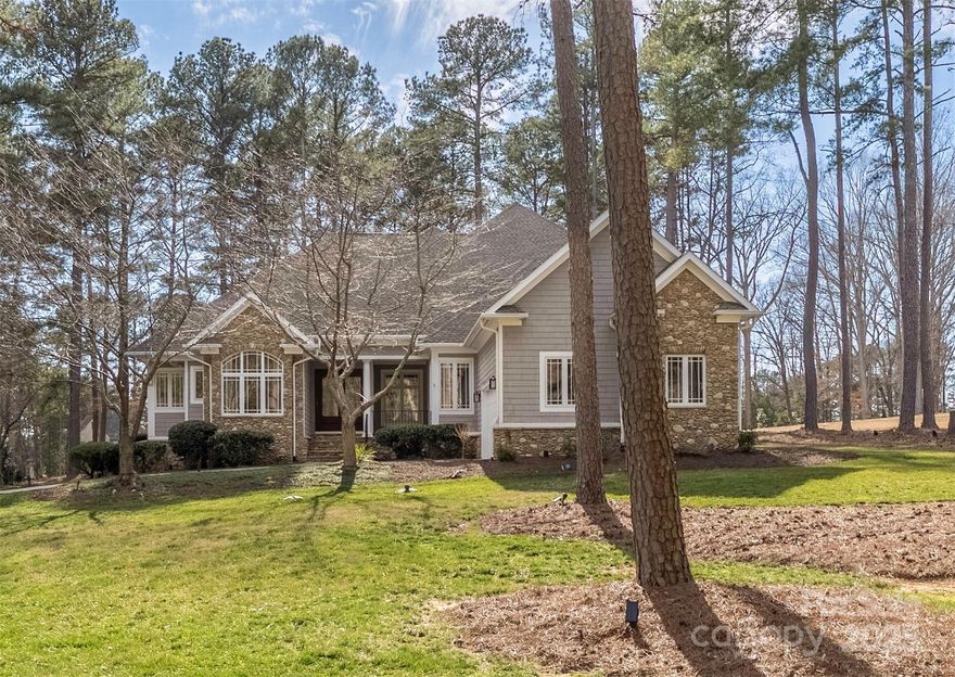 Welcome to 1718 Brawley school rd in The Point! Situated on a beautiful 1.5 acre lot on the 2nd hole of Trump National Golf Club, this magnificent 4bed, 3.5 bath offers a resort lifestyle! Bring the outside in with wall-to-wall windows that provide panoramic views of the lush greens. Easy entertaining indoors & out with a wide covered patio & sliding glass doors.
The main level boasts a private master suite with an updated ensuite, an office, a guest suite with a full bath, an oversized laundry/crafts room with a huge center island as well as a separate mud room with direct external access. Upstairs, 3rd & 4th bedroom, bath, balcony, built in work/study station and a bonus room with a fireplace! Ask about the list of extensive upgrades- new HVAC, encapsulated crawl, black out shades, tankless water heater etc. Boat slips available for lease. Room for a pool. Home has been meticulously maintained & won't disappointed! Furniture virtually staged, home is currently empty.