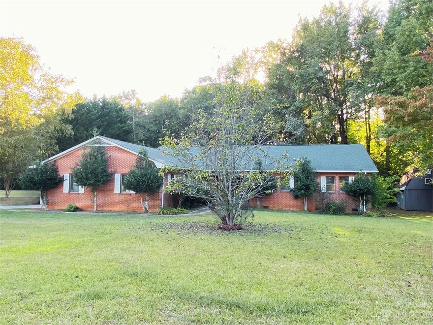 Welcome to 12724 Bain School Rd., a home bursting with potential. This 3-bedroom, 2-bathroom brick ranch includes a unique garage conversion for added space. Sitting on approximately 1 acre with a 16x20 storage building, this property offers room for outdoor activities and storage. Conveniently located near Mint Hill amenities, schools, and I-485, it's a fantastic opportunity to own a home in a great location. Ready to put your creative mark on a property? Your canvas of possibilities awaits. Contact us today to schedule your private showing!