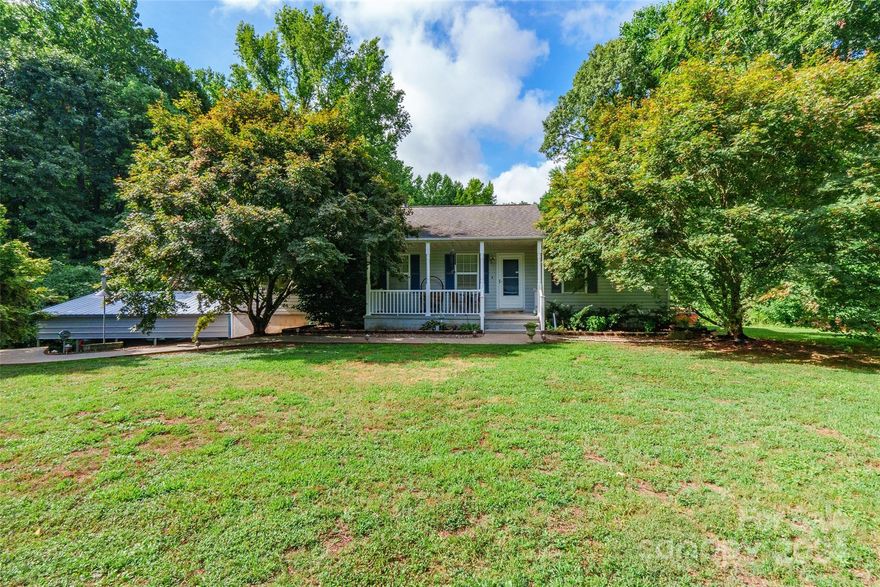 Discover your charming retreat with this delightful 3 bedroom, 2 bath home nestled on 4.37 acres of land with a pond! Step onto the inviting covered front porch, where wood floors guide you through the main living areas, creating a warm and welcoming atmosphere. The adorable kitchen boasts ample cabinet space and a convenient breakfast bar that opens to the dining area, perfect for gatherings. Each bedroom offers spacious comfort, while the partially finished basement includes a versatile finished room currently used as a game room. Double doors off the dining area lead to a covered screened porch, which transitions seamlessly to an open deck—ideal for enjoying the peaceful surroundings. Outside, indulge in relaxation with a hot tub and gather around the fire pit for cozy evenings under the stars. The greenhouse conveys. This home is perfectly situated and located in the desirable Clover school district, making it the ideal option for your next home!