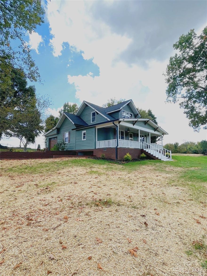 Indulge in rural tranquility within this captivating 1613 sq. ft. Hiddenite, NC residence, embraced by 2.37+/- acres of serene landscape. Equipped with essential appliances, this charming home ensures seamless comfort. Benefit from an outbuilding, an unfinished basement, and a unique garage door feature for versatile usage. Enjoy modern updates - new flooring, fresh paint, a new roof, and vinyl windows, all completed in 2023. This exquisite home offers contemporary comforts amidst serene surroundings, promising endless possibilities for comfort and style.