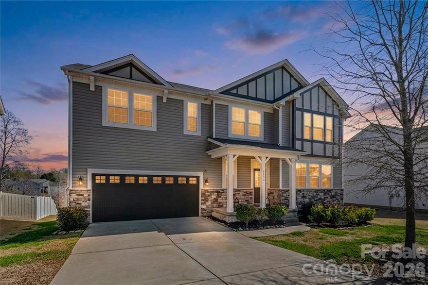 YOU HAVE ARRIVED!!! Beautifully designed 5 bed, 3.5 bath house offers open floorplan with flex spaces that adapt for your everchanging needs. Main level features seamless great room and kitchen combo enhanced by cozy fireplace—perfect for gathering and entertaining. Just off living area, step onto the deck overlooking a private backyard with wooded common area behind and generous space between homes for added privacy.  Not to be missed is highly desirable main-level bedroom with its own ensuite bath (ideal for guests or multi-generational living, or office space, or...) plus convenient half bath for visitors.  Generous flex space can be dining room, playroom, office, or whatever you decide. Upstairs, you’ll find spacious loft, three secondary bedrooms, full bath with double sinks, and centrally located laundry room. Primary suite (with generous closet) provides a relaxing retreat with ensuite bath, perfect area to unwind after busy day.  Enjoy neighborhood amenities including pool and playground, all while being minutes from major highways, shopping, dining, and everything Charlotte has to offer.  This one truly checks all boxes- space, privacy, awesome location.