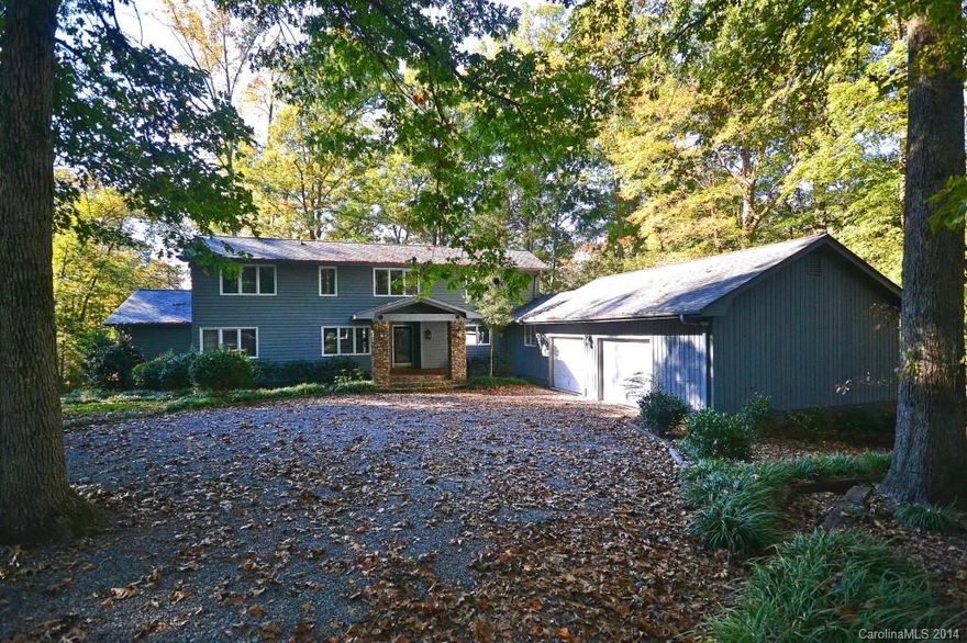 Lake Wylie Waterfront! This beautiful home sits 1.26 acres with 178 feet of waterfront. Dock is in place and walks out to boat house and lovely lake views. Home sits on a wooded lot and features 4 bedrooms, 2.5 baths and a spacious deck. No HOA, lots of room for parking RV and water fun crafts. Second detached garage provides space for work shop or additional parking. Come and enjoy lake life living!