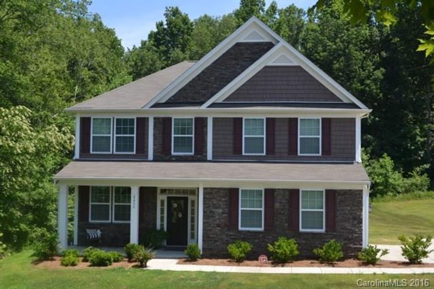 This gorgeous 2 story home sits on almost an acre at the end of the street with beautiful trees lining the back yard in a gated community located close to I-77. It is one of the more secluded lots with a double stone paver patio and built in fireplace and coyote grill. The inside has the master down and 3 bedrooms up. Bonus room can also be used as a 5th bedroom.
Kitchen has hard woods, stainless appliances, granite, and eat in bar area. Open living room with fireplace, made for entertaining.