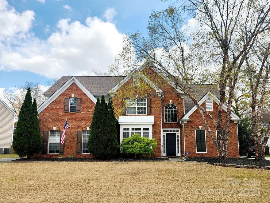 Stunning Brick-Front Home in Desirable Cady Lake! This beautiful home sits on a large lot & features a primary suite on the main level with a renovated, spa-like bathroom & walk-in custom closet. Spacious, open floor plan boasts soaring ceilings & abundant natural light in the 2-story great room & foyer. Gourmet kitchen - granite countertops, large island, SS appliances, cozy keeping room, breakfast area, & built-in desk. Formal dining room & butler’s pantry. Upstairs, are 3 generously sized secondary bedrooms, including one with en-suite bathroom, huge bonus/5th bedroom. New carpet on the main level & bonus room! Level fenced backyard features mature trees, lush landscaping, extended paver patio & serene fountain—perfect for relaxing or entertaining. Prime Location near Rea Farms, Waverly, Stonecrest, Promenade, and Blakeney, offering endless shopping, dining, & entertainment options.