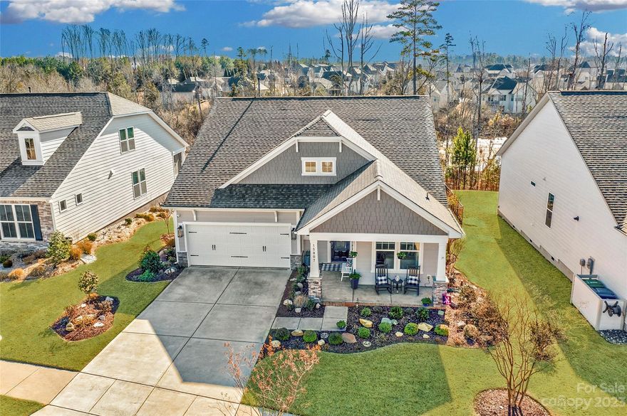 This beautiful 1.5-story Bonterra home is in the amenity-rich Palisades. Gleaming hardwood floors unite the open floorplan. A guest bedroom with a full bath is at the front of the house and an additional bedroom/study with French doors is just down the hall. The kitchen is a chef's delight with upgraded Kitchenaid appliances, a dual fuel range an oversized kitchen island, and ample white cabinetry and Limestone backsplash. The breakfast area has a sliding glass door to the delightful screened-in porch and expansive deck with a lake view. The main floor primary suite has tray ceiling expanded bay windows, & an oversized glass-enclosed shower. The bonus room makes a great entertaining or flex space, with an extra large storage room that can be converted into a bedroom. Community paddlesport access to Lake Wylie, a Social membership to the Palisades Country Club is included in the HOA & includes pool, tennis, pickleball, fitness, and access to the amazing clubhouse!