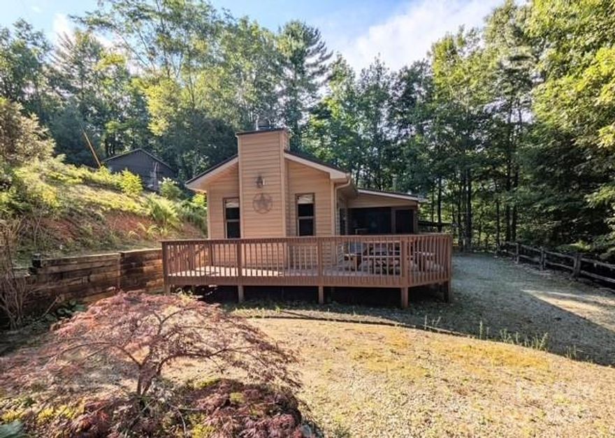 Movitvated seller! This single level home offers a cozy living room with rustic ceiling beams & gas fireplace, kitchen with barnwood cabinetry & breakfast bar for 4 and a den with good natural light. The primary bedroom with en suite bath is located at the end of the house for maxiumum privacy. The 2nd bedroom is just down the hall with a full bath next door. There are 2 mini-splits for central heat/air and ceiling fans in most of the rooms. A propane wall heater & wood stove guarantee plenty of heat in the event of a power outage. Nice screeend porch, which also serves as the main entry, has enough room for dining or relaxing and opens to a large uncovered deck. Attached carport has room for one vehicle and there is a connected workshop/shed area for extra storage. Easy turn around area and extra space for additional parking. The yard has been partially cleared and offers enough room for gardening, a fire pit or could be fenced for a pet area.