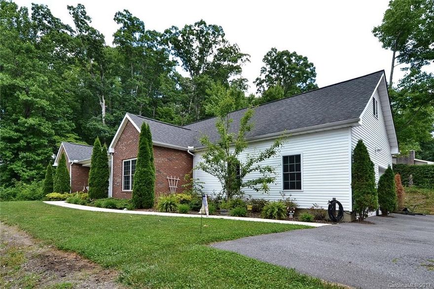 Located in the Bethel area &Convenient to Asheville,Waynesville & Canton is this 4BR/3BA spacious home w/wonderful indoor & outdoor living spaces.Boasts open floor plan,huge great room w/Fireplace,open kitchen w/island/bar,huge main floor master & bath,additional main floor bedroom & bath,wonderful media room,upper level family room & 2 additional guest bedrooms & bath,& 12X24 storage area.Front covered porch,spacious back porch/patio for entertaining & 2 car garage.