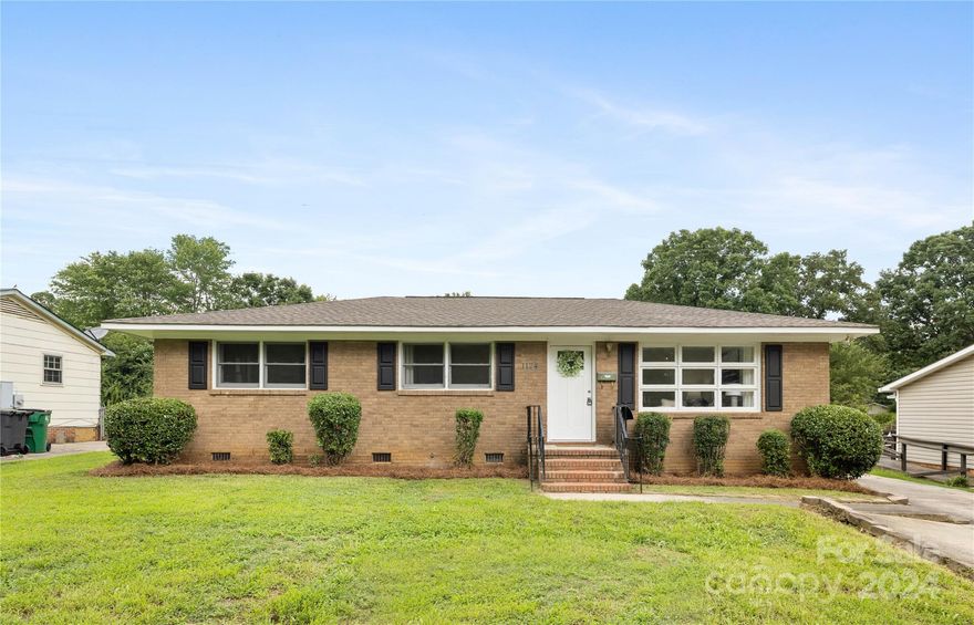 Charming 3 BR, 1.5BA all brick ranch home. This home boasts a spacious floor plan with an updated kitchen with shaker/soft closing cabinets, granite countertops & newer all-black appliances. Hardwood floors run throughout the living areas & bedrooms. Enjoy an oversized backyard perfect for entertaining family & friends. Plenty of natural sunlight & space on this oversized lot to build an additional unit (ADU) for the in-laws or extra rental income. This Gem is located in an opportunity zone in the desirable Hidden Valley area. Upgrades within the last 5 years include a new roof, water heater, plumbing, electrical for kitchen, bathroom & laundry, HVAC, cabinets, granite countertops, subway tile, tub/tile surround, appliances, & light/plumbing fixtures.  This stunning 1080SF home is nestled 4 minutes from the light rail station, conveniently located near shopping centers & restaurants, just 6 miles from uptown Charlotte, & 25 minutes from the airport. This one won't last!!.