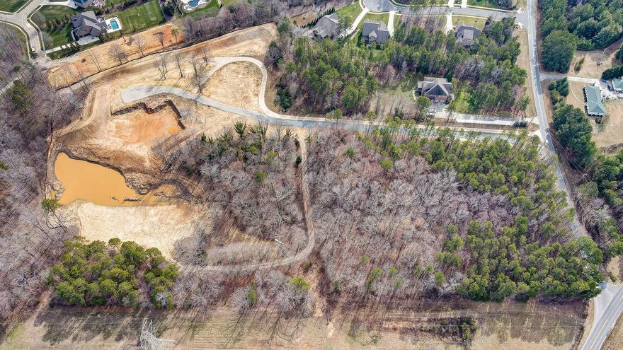 Stunning, private 14.70 acre (+/-) property located in desirable Wesley Chapel. Situated ideally in Union County, within the highly rated Weddington school district. This property has a rural feel yet is only 1.2 miles from Target, Chick-Fil-A, shops, restaurants, medical offices, etc. The land is ready for your custom estate to be built. Permitted well and perc test in place (septic needed). Driveway in place. Basement site is already dug out and is ready for the foundation to be poured should you decide to do a basement build. This property has an expansive pond (large enough to kayak), privacy all around with mature trees, an area of pasture for potential animals, and a private entrance. Sellers have done extensive site prep, including building demo and clearing (removal of old house), site grading, privacy berm built alongside the back of the property backing up to Quintessa, and pond expansion. This tranquil property truly is a rare gem for the area with many possibilities.