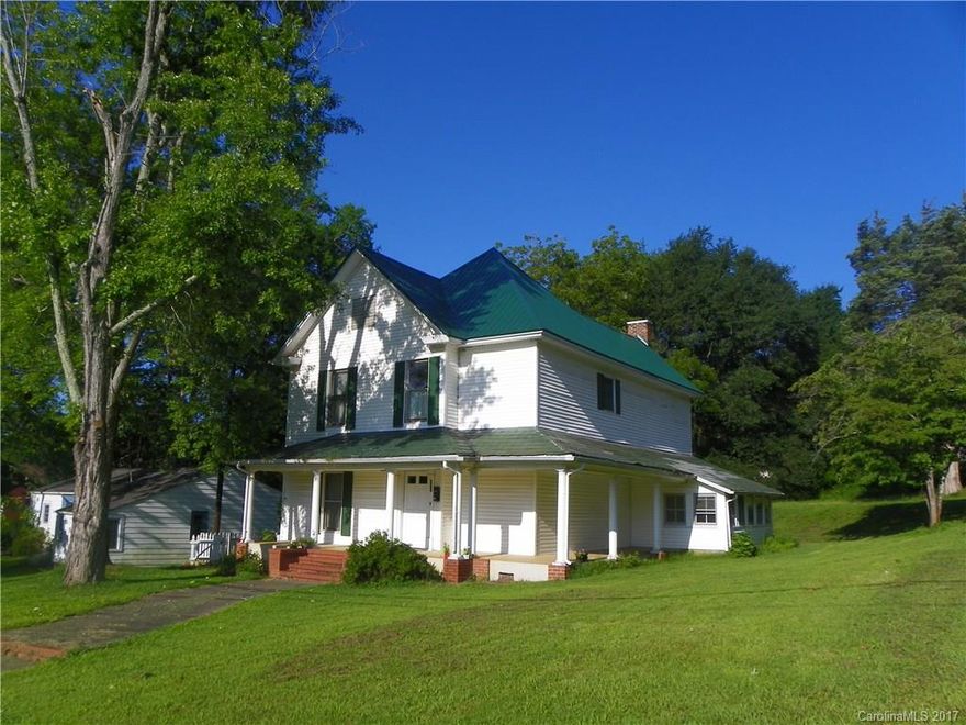 Conveniently located, this affordable historic farm-style home has been remodeled in recent years. Just blocks from uptown Rutherfordton, the home could be updated to be a fantastic residence.  Large kitchen has loads of cabinets & countertop space, a bay window, & spacious dining area.  Beautiful original wood floors are in the open foyer. 4 bedrooms & 3 baths are perfect for a large family.  Oversized lot has great yard w/ backyard patio. This historic home has tons of potential!