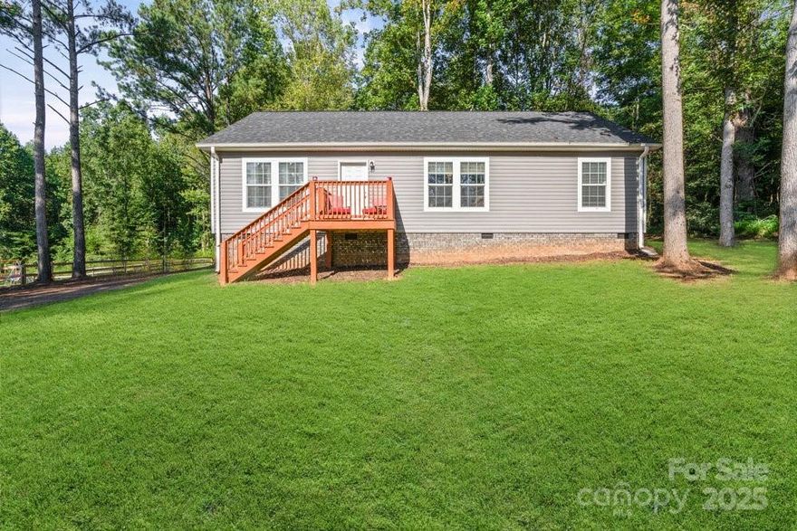 Just minutes from Statesville and Troutman, this delightful 3-bedroom, 2-bath home offers the perfect blend of privacy, space, and modern comfort — all on 1+ acre surrounded by mature trees.

Enjoy peaceful mornings and relaxing evenings on the spacious 10’ x 12’ back porch, overlooking a large, tree-lined backyard with room to roam, garden, or entertain. Have animals? A brand-new 25’ x 25’ kennel was installed in 2025 — a rare bonus!

Inside, you’ll find a bright, open-concept layout featuring a spacious kitchen with abundant cabinet storage, a center island, and seamless flow into the dining and living areas — ideal for everyday living or hosting guests. Fresh neutral tones throughout create a clean, modern feel ready for your personal style.

? Over 1 acre of land
? Move-in ready with modern updates
? Private, peaceful setting
? FHA & USDA eligible