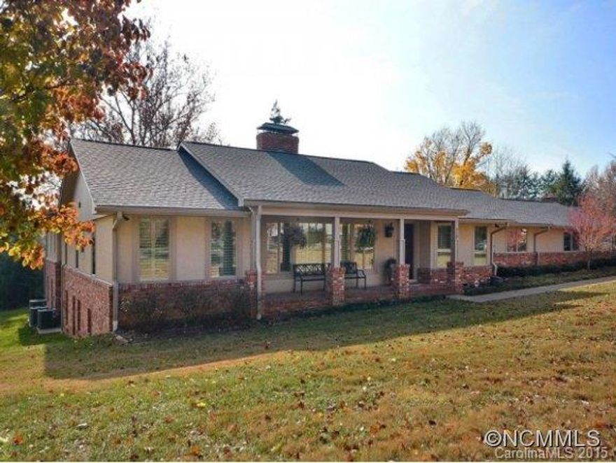 North Asheville - move in ready - handicap accessible with elevator. Main level offering formal living & dining rooms, kitchen with breakfast bar and nook, granite counters and Viking appliances, keeping room with woodburning fireplace, den with wet bar, office with built-ins, laundry room, 3 bedrooms, 3.5 baths. Downstairs offers flex/workout space, bedroom, recreation room with wet bar and 2 baths. Private back yard with covered patio.