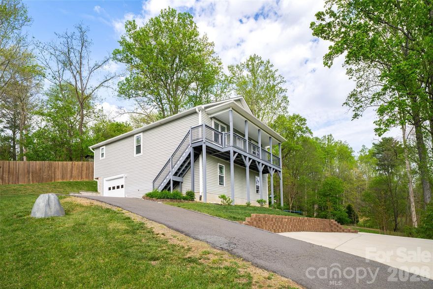 Start your next chapter in Asheville with space, flexibility, and the kind of privacy that is getting harder to find. This 3-bedroom home with bonus rooms offers a smart layout designed for real life, with bright open living spaces, a spacious kitchen and dining area, and additional finished lower-level space that gives buyers options for a media room, playroom, gym, office, guest overflow, or hobby space. The large yard creates room to spread out, entertain, garden, or simply enjoy the peaceful setting, while the elevated position and surrounding trees add a sense of privacy that feels tucked away without giving up convenience. With no HOA restrictions, buyers have more freedom to live the way they want. Whether someone is looking for a primary residence with extra versatility or a home that supports a new season of life in Asheville, this property delivers comfort, usable space, and the lifestyle buyers are chasing in Western North Carolina.