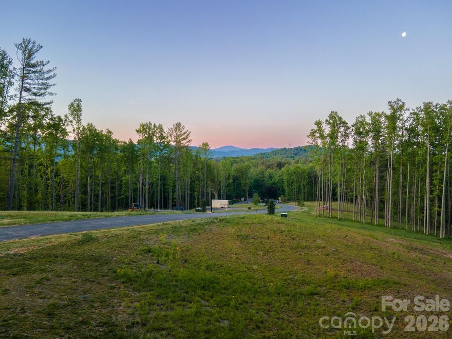 Homesite Eight at Harris Cove is the community's largest and defining parcel at about 2.04 acres, at the quiet terminus and accessed off the private T-turnaround. Year-round long-range views stretch across the Blue Ridge foothills, and the scale of the parcel allows the home, outbuildings, and landscape to be composed as a single, coordinated gesture, subject to design review. The lot extends toward the ridgeline, opening potential for a private trail or hilltop outlook. A signature parcel for a signature build. Harris Cove is a private, gated, eight-lot community off Irvine Drive in Fairview, NC, near Asheville, with a restaurant, brewery, ice cream parlor, and library a short distance away. It includes a private road, gated entry, street lighting, underground Duke Energy power, and shared StormTech stormwater, with well and septic per lot.

Every home is reviewed by an Architectural Review Committee; Tykke Homes is the preferred builder, and other qualified builders are welcome.