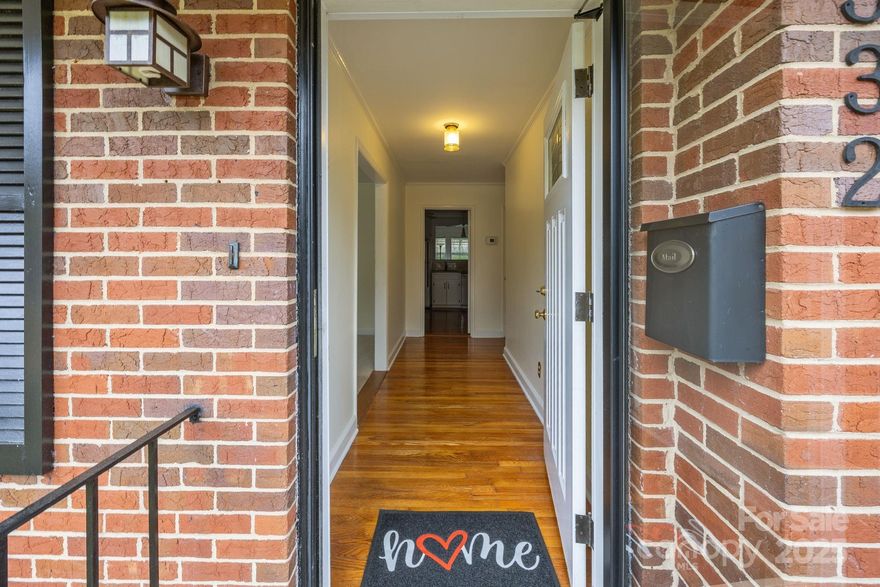 This well-maintained mid-century brick ranch located in highly-desirable Madison Park is waiting for YOU! Charming home offers a fantastic floor plan that flows effortlessly from room to room, perfect for everyday living and entertaining. The classic layout with welcoming foyer has a large living area with great natural light, formal dining/flex room, and a well-designed eat-in kitchen. Sunroom off kitchen might become your favorite room as the wall of windows overlooks the fenced yard. Low-step Utility Room entrance allows easy access with groceries, stroller, or wheelchair and houses the washer, dryer, and water heater. It offers extra storage in addition to the well-sized BR closets, expansive hall closet, and attic with new stairs. Updates include: HVAC and thermostat (2023); Roof (2015) inspected with new vent pipe boots installed in June 2025; most of interior painted in last 2 years; granite c'tops, hardwood flooring, and hardware in eat-in kitchen updated within the last 5 years; hall bath fully gutted/modernized; BRs 2 & 3 windows replaced; deck/shutters/railing painted 2024; new motion sensor security light at side door; new smoke detectors in hallways. Original solid hardwoods in foyer, hallways, BRs, and Dining/Flex Room. Kitchen is hardwoods, just not original. Seller has always had Living Room carpeted so is unsure if wood floors are underneath. Minutes to Montford/Park Rd establishments and SouthPark Mall. Sidewalks and nearby Madison Central Park and Pinewood Elementary offer fitness opportunities as well as a playground and disc golf. Easy commute to uptown Charlotte by bus, light rail or car, and I-77, I-85, and Charlotte International Airport. Whether you’re looking for a smart investment or value space and location, this could be the home for you!