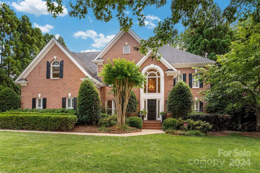 This full brick Ballantyne Country Club home is on a flat, private lot with a brick terrace and fenced yard. Step into a 2 story foyer with an office/guest BR and a full BA on the main floor. Extra powder room for guests to use. Bright kitchen with freshly painted cabinets and neutral granite, stainless Viking and Bosch appliances. Beautiful hardwoods all on the main floor. Upstairs, a MBR boasts a tray ceiling with updated BA, closet system. Gorgeous moldings throughout. There are lots of options for BR and office use. Gym floor in garage, can park on it or use as work out space. Extra space for a workshop, hang down storage in garage. Plantation shutters throughout. 
 HVAC replaced in 2021.  Carpet replaced in 2021.  Neighborhood is full of walking trails, playgrounds, basketball courts. Located close to the back entrance to allow easy accessibility and close proximity to the new Ballantyne Bowl where you'll find a park, restaurants, markets on the weekends and an amphitheater!