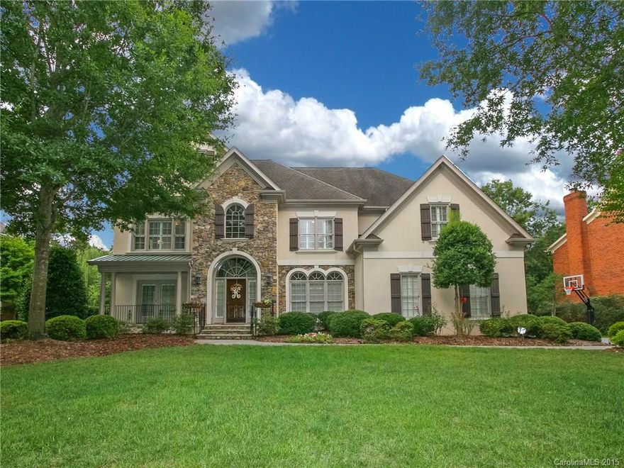 Stunning Stone & Stucco Hm w/covered Front Porch. Open Foyer w/Arched Opening to Formal DR.  Plantation Shutters & heavy trim work. Hw's on entire 1st flr.  GR w/Built-In Bookcases and Gas FP. Gourmet Kit w/Cristallo Quartzite Countertps, Designer Backsplsh, Double Wolf Convection Oven, Dacor Gas Cooktop, Wine Cooler & Built-in Fridge.  Master Suite w/FP w/ Bayed Sitting Area. Elegantly Updated Master BA, Marble Flrs, Shower & Soaking Tub. Guest Suite on Main, all Brms have access to Baths.