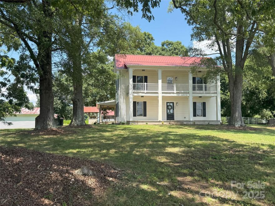 Acreage!!! Fully renovated southern farmhouse on 15.6 acres of mostly cleared beautiful farmland is a must see! Beautiful land for horses or farming. Create your own mini farm! Great location close to I77 with county taxes only. One of the buildings is 1152 square feet and would be perfect for second living quarters, possible income producing rental, or workshop, finish to your needs. Other buildings could be used for barn, workshop, storage or chicken coop. Enjoy summer evenings from any of your 3 covered porches or hang a swing from the huge old oak trees. Updated kitchen and bathrooms boast quartz countertops and new cabinets. All new stainless steel appliances remain. Luxury final flooring throughout. Primary bedroom features a walk-in tiled shower, dual vanities and oversized walk-in closet. Great room dining room combo is perfect for get togethers.