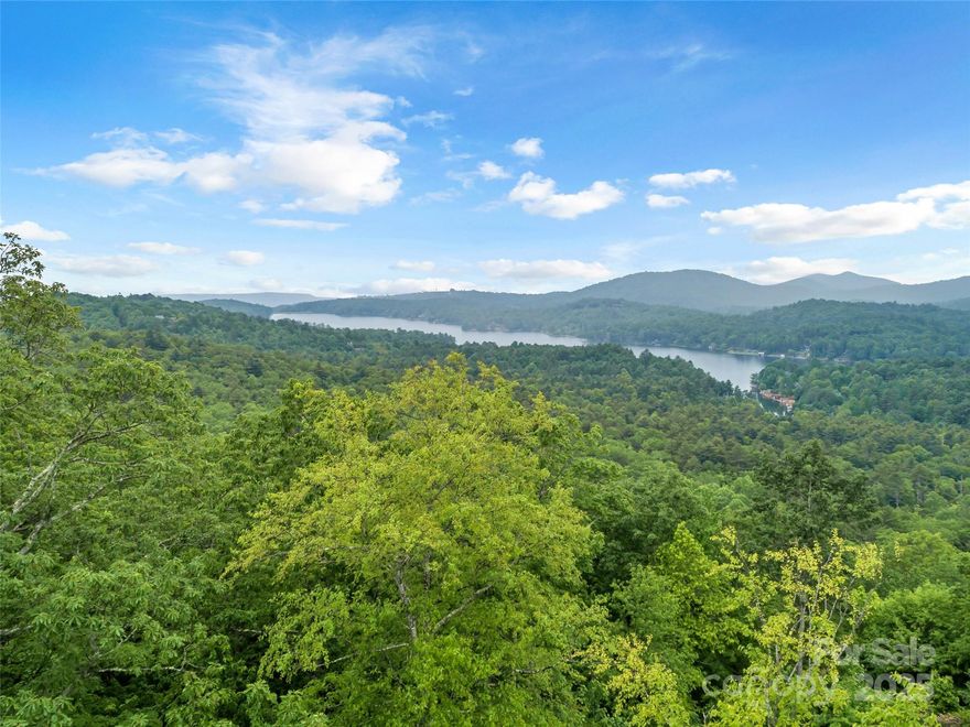 Three parcels with WELL & SEPTIC ALREADY INSTALLED! Top parcel has been cleared and prepped for homesite, including a boulder retaining wall. Underground electricity already on site. Amazing views of Lake Toxaway to the North. Light restrictions are as follows: No livestock, poultry, trailers, outside privy, or large animals.