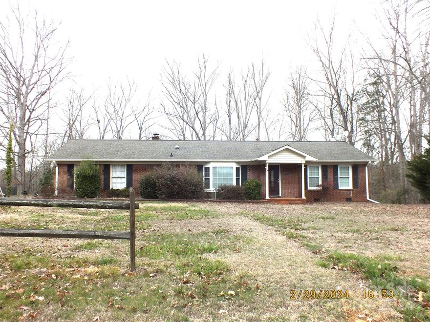 Just reduced, leaving plenty of room for remodeling, this is a great opportunity to own in Arrowood and make it your own, 2 level with basement, updated kitchen, 3 bedrooms 2 baths on upper level, living room, dining area and kitchen on main, nice bay window in dining area, stairs leading down to full basement area with fireplace, another bedroom & bath and laundry room. Extra storage connected to laundry area. Outside offers screened porch, additional storage, and a 20x20 separate storage building with bay door. Tons of space to make your own, home needs some work and price is reduced to allow for some repairs. Home is being sold AS IS.