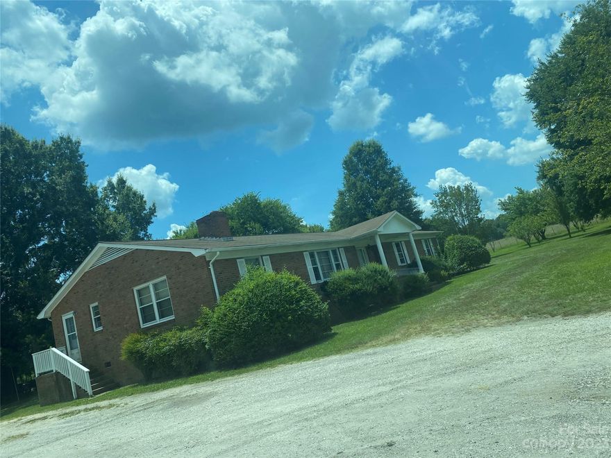 4 bed 2 bath, full brick ranch with ACREAGE. Twenty-One expansive acres, on two adjoining parcels. Land is level and cleared. Newer HVAC and Well in the last few years. Sold As-Is.
