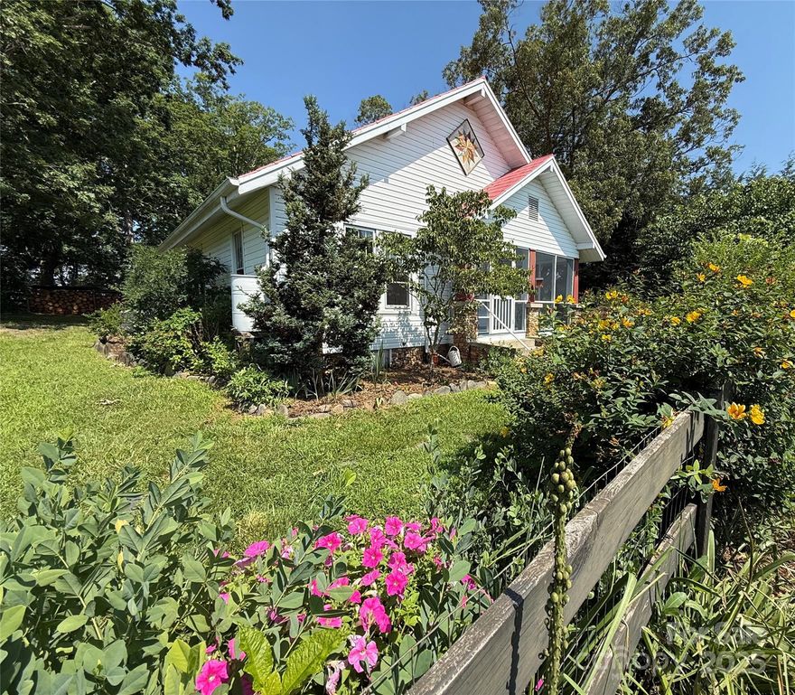 22-Acre Turnkey Homestead/Farm/Off-Grid Retreat in the Heart of Western, NC.  

Finally, a secluded, one-of-a-kind, fully equipped homestead with flat usable land allowing room to grow. Plus, long-range mountain & sunset views without having to live on the top or the side of a mountain.  

Classic 3BR 2.5 Bath 1930 farmhouse (c.1436 sq. ft.) is one of the best-preserved of its kind, with straight original wood floors (newly refinished,) high ceilings, mudroom, screened porch, new quartz countertops, and good bones. Storm-door basement/cellar keeps produce cool. Full morning sun, cool afternoon shade, frequent breeze.  
Working organic blueberry farm treated kindly with NO toxic chemicals or fertilizers. Farm and domestic animals, welcome! Fenced & gated perimeter, 5 paddocks w/ water spigots. 6 acres of forest w/ clear, year-round creek attracting deer, turkey, hawks, and eagles. And so much more! 

RV hookup. Solar & electric. Well & county water. 
Pre-listing Home Inspection