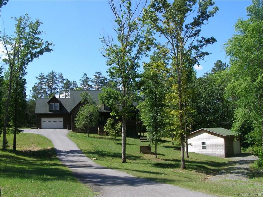 Enjoy your privacy w/this beautiful brick & cedar siding custom home nestled on a 2 acre, cul-de-sac lot. Wrap-around porch on 3 sides w/nothing but wooded views! Vaulted GR features stunning windows & is open to gourmet Kitchen w/ center island, granite, tile backsplash. 1st flr Master has sitting area, room-sized WIC, w/sep. coat closet & HW floor, whirlpool tub,double vanity. HWs in main living & upstairs common area. Tile in baths. Large secondary BRs. Good storage throughout + outbuilding.
