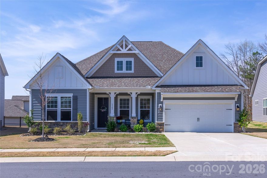 Located in a quiet Indian Land cul-de-sac, this single-story home offers quick access to Ballantyne, shopping, restaurants, and health care facilities. It features an open layout with a formal dining room, great room with gas log fireplace, and a kitchen with a large island, farmhouse sink, wall oven, microwave, and gas cooktop. Luxury vinyl plank flooring extends through the kitchen, dining, and breakfast areas. A guest suite has a private bathroom; two additional bedrooms share a full bath. The primary bedroom includes a garden tub, tiled shower, and walk-in closet. The neighborhood has a community pool. Low Lancaster County taxes.