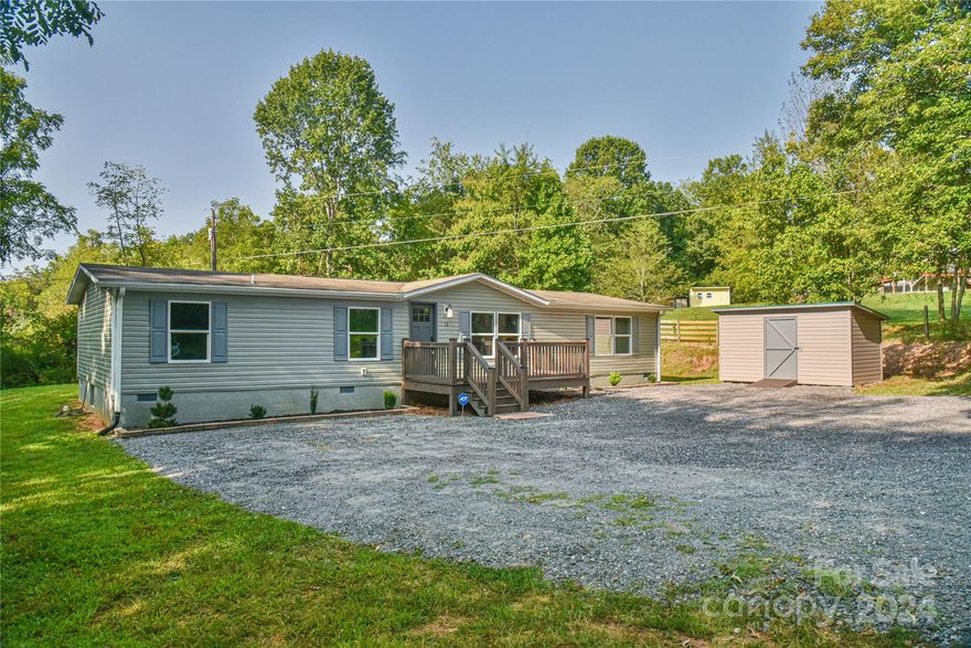 This approximately 1600 sq ft home has been tastefully remodeled and is in an excellent location in East Asheville! Some updates include: kitchen with built in refrigerator, granite counters and large island, new ceramic tile baths, shiplap wall, new flooring throughout, fresh paint, new modern light fixtures and custom closets. Enjoy a private level backyard. This location is ideal as it's just a few miles from Downtown Asheville and the River Arts District, the French Broad River and the Blue Ridge Parkway entrance. Be minutes away from tons of shopping and dining options as well as schools and hospitals. One year home warranty included with acceptable offer. All this plus no city taxes and public water and sewer!