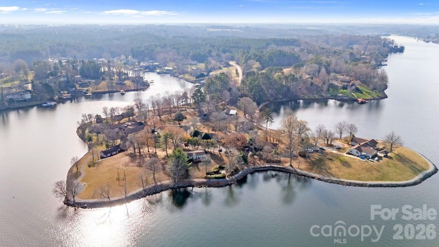 Premier Lake Hickory Development Site with Established Campus Infrastructure – 23+ Acres, 3/4 mile of Lake Hickory shoreline.
This exceptionally rare 23-acre waterfront offering on Lake Hickory in Conover, NC combines development-ready scale with a proven operational footprint. Zoned PD, the property is currently utilized as a fully functioning Boys Academy campus, demonstrating the site’s capacity, infrastructure, and regulatory viability for large-scale residential, institutional, or hospitality uses.
The existing campus includes 12 buildings, featuring 35 bedrooms and 28 bathrooms, and is designed to accommodate approximately 65 overnight residents and up to 140 daytime occupants. Supporting facilities include a central dining hall, residential and administrative structures, a publicly operating zipline with dedicated facilities, a floating dock, a beach area, and a graveled 3/4+ mile walking trail around lake, all of which underscore the property’s adaptability and immediate functional value.
From a developer’s perspective, this property offers a rare combination of:

Approximately 3/4 mile of Lake Hickory shoreline, suitable for possible future premium waterfront homesites

Contiguous 23+ acres with established internal circulation and utilities

Existing vertical improvements, allowing for adaptive reuse, income generation, or phased redevelopment

Proven operational history as both an academy campus and a short-term rental / Airbnb property

Catwaba County Planning staff could support this property being rezoned as Residential R-40. Currently, PD zoned, supporting luxury residential and estate-style waterfront development
The current Boys Academy use provides clear evidence of density tolerance, utility capacity, and access, significantly reducing unknowns for future redevelopment or repositioning. The site is well-suited for luxury lakefront estates, a private residential enclave, destination retreat, wellness or education-based reuse, or continuation of institutional operations.
Strategically located near Hickory, Mooresville, and the greater Charlotte region, this offering represents a high-barrier-to-entry waterfront asset with both near-term income potential and long-term development upside.
Large-scale Lake Hickory opportunities with this level of shoreline, zoning, and infrastructure are exceedingly rare.