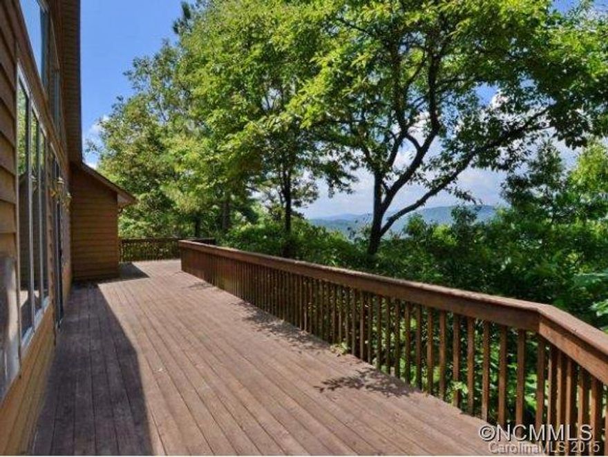 Seller says bring an offer!!!Views,vaulted ceilings,open flowing floor plan.Your oasis in the mountains awaits you.Vaulted master w/fireplace,hardwoods flow onto the expansive deck. Master boasts two vanities,walk in closet & fabulous views.Lower level entertainment room with a lower deck.Fireplaces,two bonus rooms,one with a closet round out the lower level.Unfinished basement has a utility sink & workshop space. Redwood decks and siding!