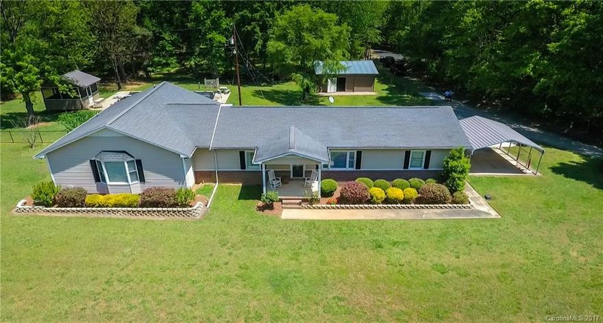 One of a kind property! Well maintained home features main level living w/ 3 bedrooms & 3 baths. Huge Master suite w/sitting area/home office nook, oversized walk in closet & bath. In ground basement w/ large entertaining space +2 additional rooms. Backyard oasis w/ pool & diving board & fountain, screened in pool house w/1/2 bath & bar. 24'x30' shop with an additional 10'x30'storage off that. Wired for generator on its own panel. Home is surrounded by 50 acres of private owned property.