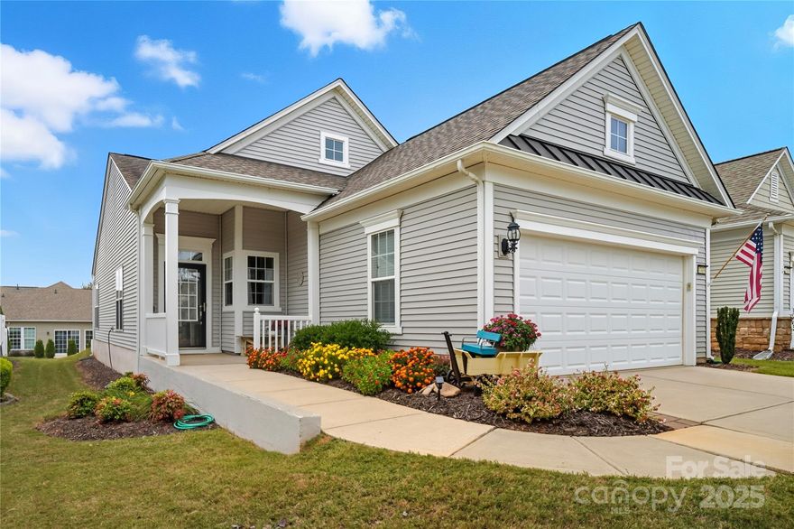 Welcome to the elegant charm of Sun City with this cozy Fox Run home. Entering the home you are greeted with a beautifully tiled foyer wainscoting accents to lift the eye. The wainscoting continues into the open dining room that extends to a sunlit living room, brightened with light LVP floors and warm tones throughout the living area. The kitchen is just off of the dining room, carrying an abundance of cabinetry, SS appliances and an adjacent breakfast nook to enjoy a morning coffee and kick start your day. Just beyond the living room, an open, tiled sunroom accesses the rear patio w/ a retractable awning to savor sunsets, a good read, or an evening card game with friends. The primary bedroom has ample space for a serene retreat, coupled with a large walk-in closet, and an en suite showcasing dual sink vanity and glass enclosed shower. The home is completed with an additional bed and bath for overnight guests. 

The Fox Run model is a home where you can truly relax and enjoy the vibrant 55+ lifestyle and the exceptional lifestyle offered at Sun City Carolina Lakes. Enjoy access to world-class amenities, including a championship golf course, a state-of-the-art fitness center, indoor and outdoor pools, tennis and pickleball courts, and a wide array of clubs and social activities.