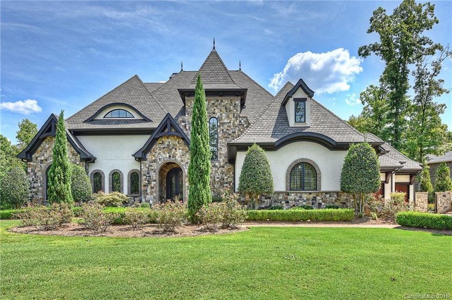 European style waterfront estate features unrivaled lakeside entertaining. Upscale resort pool/spa with swim-up bar, summer kitchen & paver patio. Classic stucco & stone exterior, copper gutters and exposed wood beams. Gourmet kitchen opens to a covered terrace with outdoor fireplace. Master suite on main level has lake views, vaulted ceiling and luxurious bath. Private beach, pier has gazebo & 3 boat slips. One of Lake Norman's premier locations near The Yacht Club & The Peninsula Club.