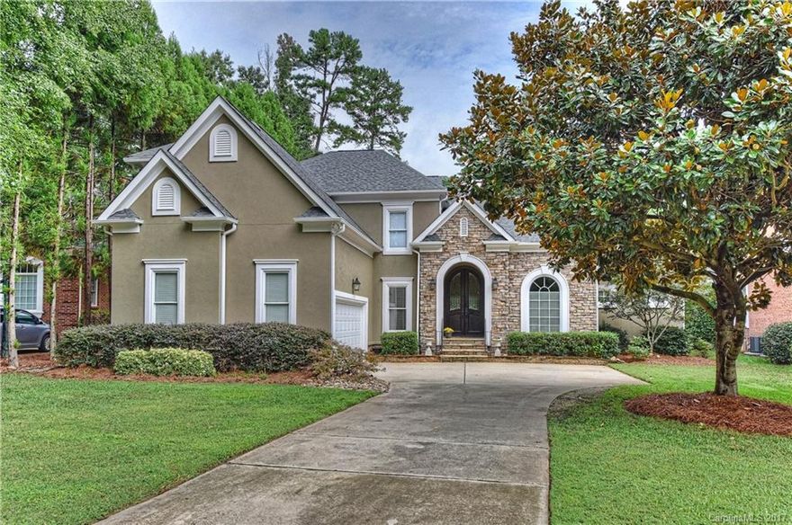 Fabulous custom built home on the 15th green.  Conveniently located across the street from the swimming pool, fitness center and tennis courts.  Two story great room with windows overlooking yard and golf course.  Recently updated master bath with dual vanities, granite counters, free standing tub and glass shower.  Two porches, open floor plan with lots of light and a perfect layout for entertaining.  Hardwood floors throughout entire home.