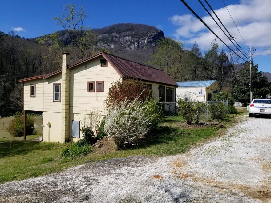 Great location in Hickory Nut Gorge for retail. Phone 828-625-9983 and ask to speak to zoning manager. You will find out exactly what you can do. City water, city sewer and 1 mile from Lake Lure Beach, 200 yards from The Flowering Bridge and 1 mile from the entrance to Chimney Rock at Chimney Rock State Park which is in the heart Chimney Rock Village. Great places to eat and shop in the village.