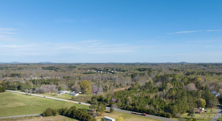 Beautiful tract of land with many possibilities just outside Rock Hill and York. The land has road frontage on both HWY 5 and Tirzah rd. It consists of 2 total parcels, 37.30 acres and 2.26 acres. The larger parcel has a duke energy power easement that crosses it but in a reasonably convenient way. There is also a pond on the property. The two lots could be developed, and then the larger parcel or used as a family estate, 2nd home, or hunting property. With approximately 1200 ft of frontage on HWY 5 and 1300 ft of frontage on Tirzah, the possibilities abound!