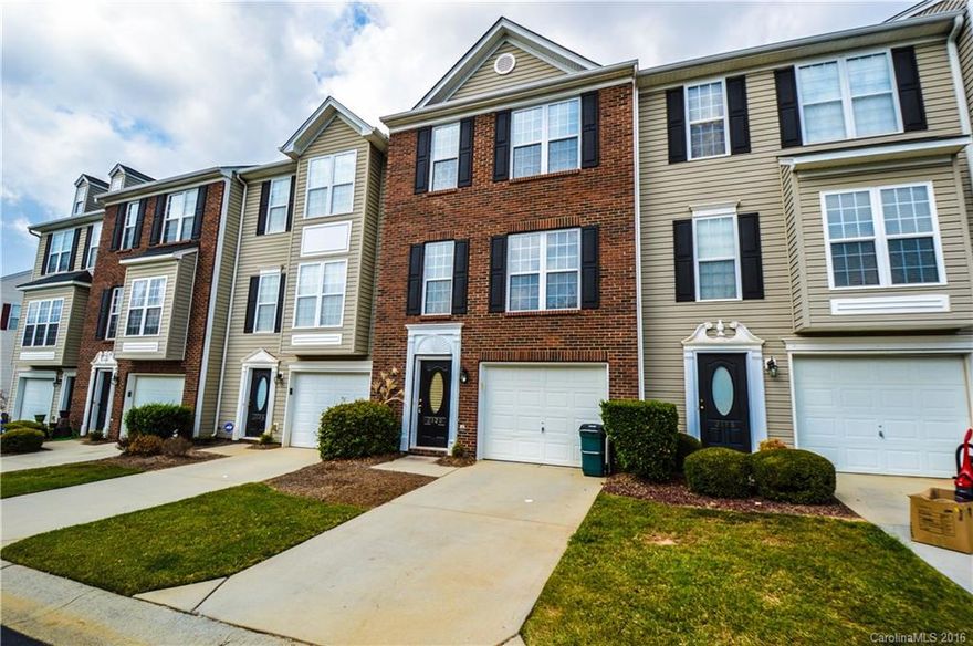 Location, Location, Location!! Move-in Ready! 3BRs - 2 Half Bathrooms - 2 Full Bathrooms. Lower Level Bonus Room with half-bath.  Open concept layout with wood laminate flooring on every floor!! Washer, Dryer, and Fridge are Walk to the Gym, Restaurants and Shopping!  Gorgeous community pool for ultimate rest relaxation!