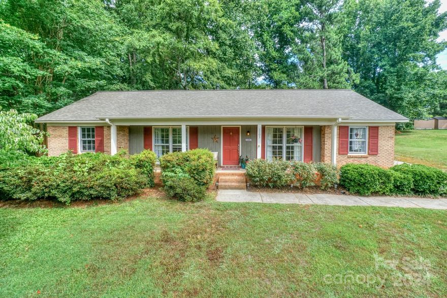 PRICE IMPROVEMENT!!! Welcome home to this beautiful brick ranch, located in a nice quiet neighborhood with an awesome hill-top rocking chair front porch with tons of mature trees and fully fenced back yard. You won't want to miss this beautiful brand new state-of-the-art kitchen and extra large island/breakfast bar and modern shaker style cabinetry, all new stainless steel Samsung appliances, new granite countertops, new LED lighting, new LVP flooring throughout.  New hot water heater installed in 2022, new roof in 2021, tubs and sink drains in 2023, gutters replaced in 2018. Additionally, in 2023 walls were been removed to create a large open concept living space, perfect for entertaining. Conveniently located to local eateries, parks, award-winning schools, easy access to I77 and all that Lake Norman has to offer.  Neighborhood is well kempt with NO HOA! This home is move in ready. Welcome home to this beautiful community in Mooresville!